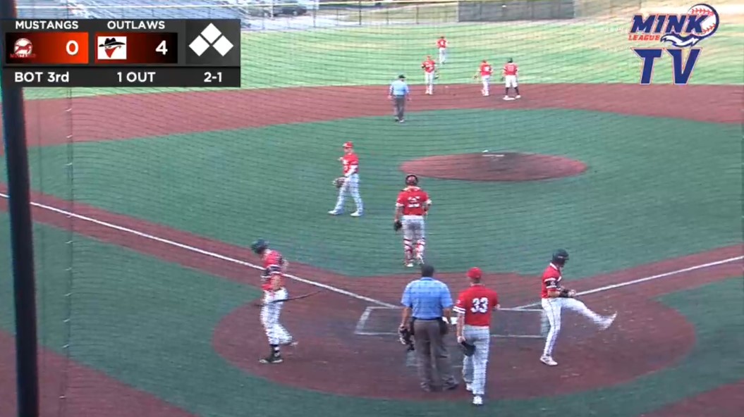 Cade Bressler scores in the big five run third inning for the Joplin Outlaws. Photo: uClickTV